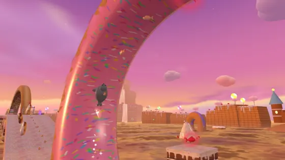Galumph riding a giant spinning donut loop in Frosting Falls.